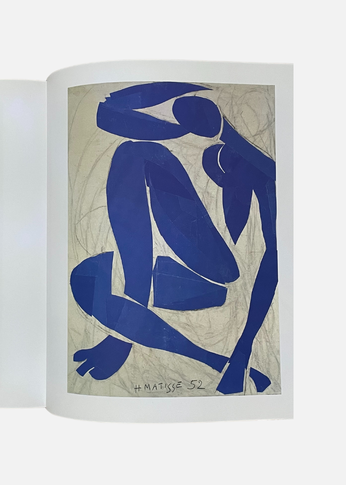 Page ouverte du livre sur les oeuvres de Matisse, montrant le Nu bleu iV de l'artiste en pleine page.